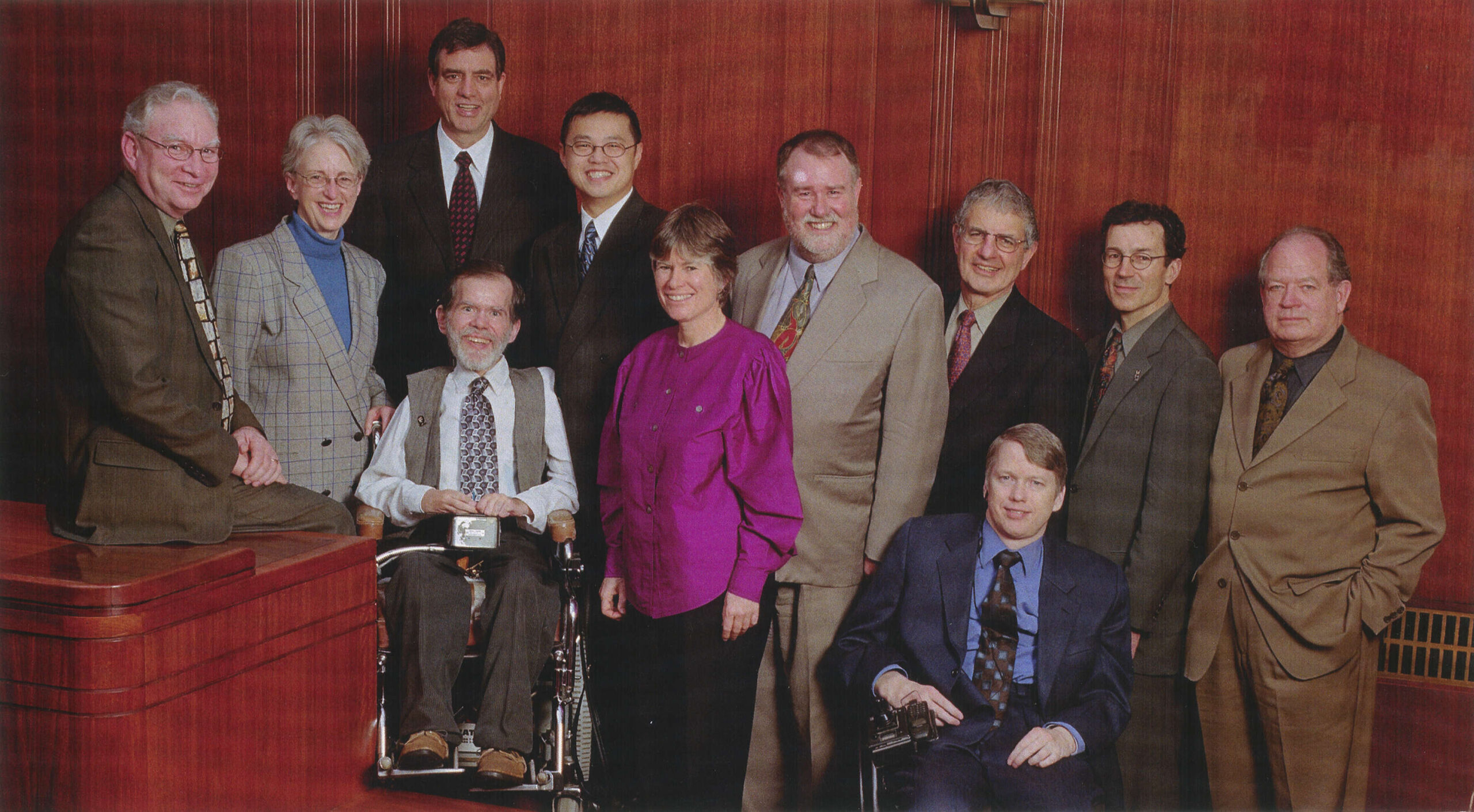 Group photograph of the 2002-2005 Mayor and Council. Louis is third from left. Other officials are (L-R): Mayor Larry Campbell, Anne Roberts, Tim Stevenson, Raymond Louie, Ellen Woodsworth, David Cadman, Fred Bass, Sam Sullivan, Peter Ladner and Jim Green. Reference code: COV-S62-1----: 2011-057.12